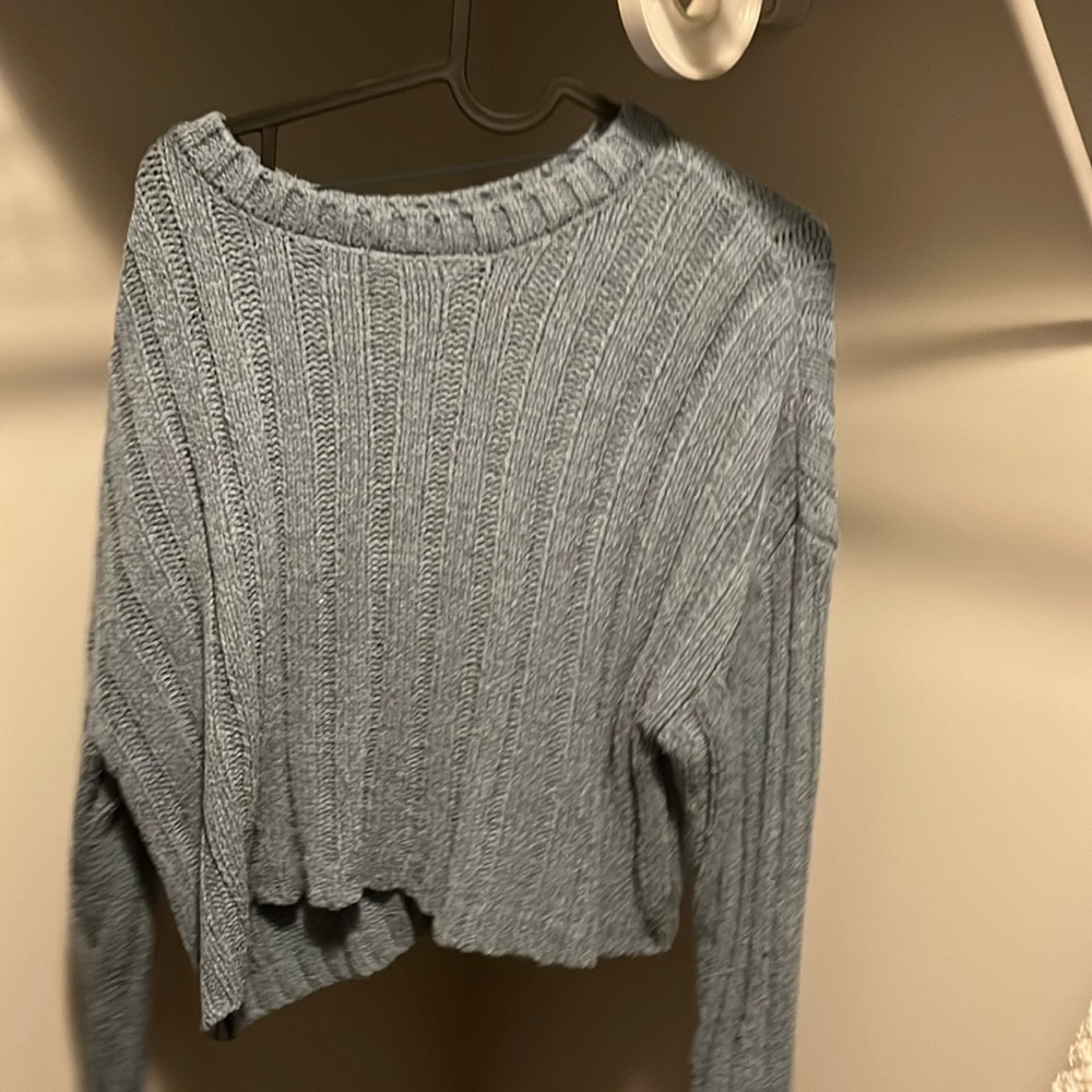Blue cropped sweater.
